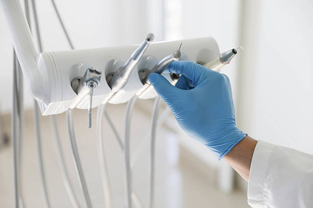 Professional Tooth Extraction technician working in Ennis, TX